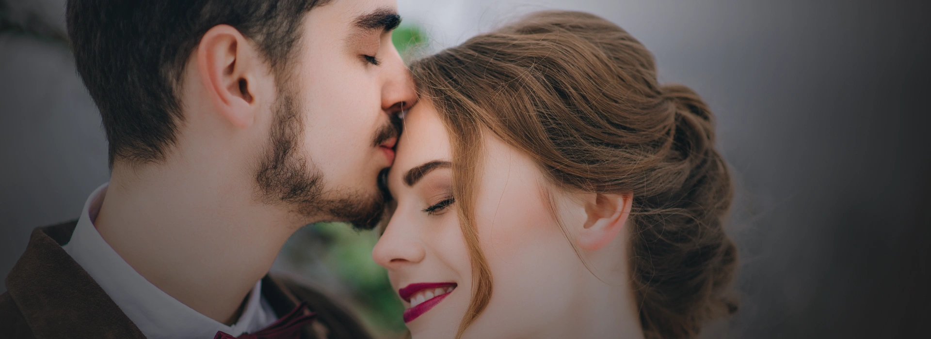 Happy couple smiling on the beach