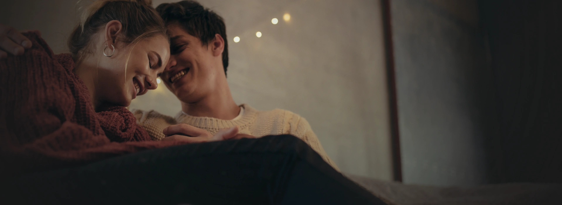 Happy couple smiling on the beach